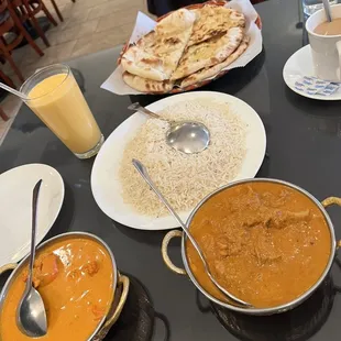 Mango Lassi, Chai, 5 Piece Chicken Tikka Masala, Butter Chicken, Large Zeera Rice, Tandoori Naan, &amp; Garlic Naan.