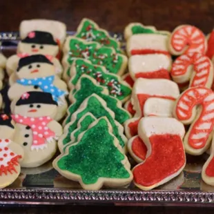 a tray of decorated christmas cookies