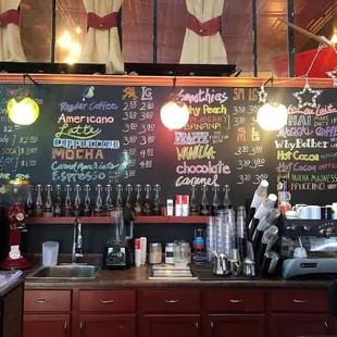 a chalkboard with a variety of drinks