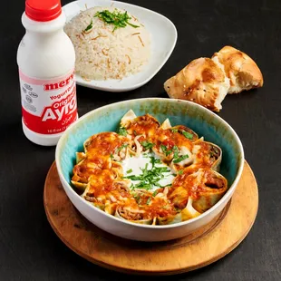 a bowl of pasta and a bottle of milk