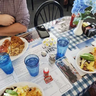 Bottom (2) are #7 omelets with cheese, shrooms, bacon and avo &amp; toast (not pictured) $16. Top is eggs, bacon, hash and toast, $12 IIRC