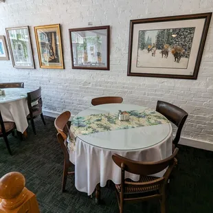 a dining room with tables and chairs