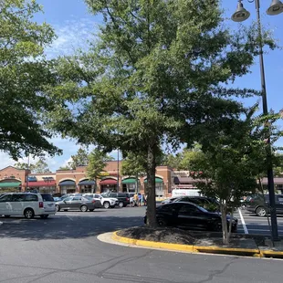 a parking lot with a lot of parked cars