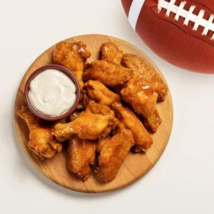 a football and a bowl of dip