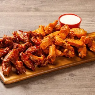 chicken wings on a cutting board