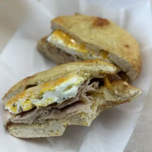 Turkey, egg, and cheese on an asiago bagel. Served hot, and very yummy!