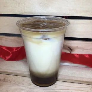 a cold drink in a plastic cup