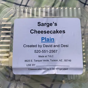 One piece of the plain cheesecake in a container.