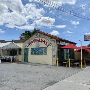 Outdoor seating and side &amp; front of eatery
