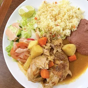 Pollo Guisado con ensalada, arroz y frijoles refritos: Stewed Chicken w/ salad, refried beans, rice  | $17.99