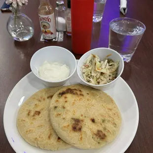 A loroco and cheese pupusa and a cheese and bean papusa. very nice :)
