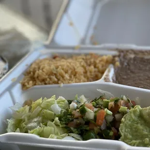 a meal in a styrofoam container