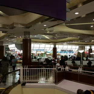 a crowded airport terminal with passengers