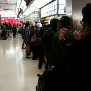 people waiting in line at an airport