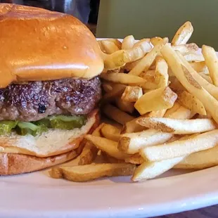 Burger and fries: cooked medium with custom made pickles only!