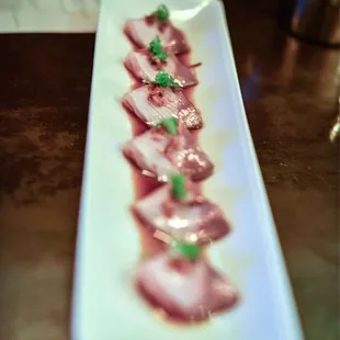 Seared Hamachi Truffle oil with garlic chips japanese sea salt on Tataki sauce