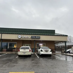 two cars parked in a parking lot