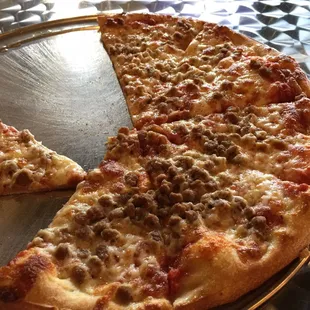 Large pizza with ground beef.