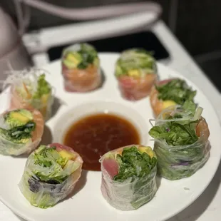 a plate of sushi rolls on a table
