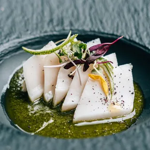 a close up of a plate of sushi