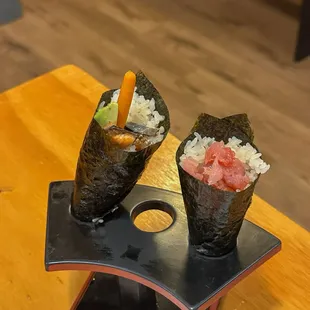 two sushi rolls on a plate