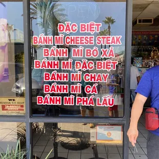 a woman standing in front of a restaurant