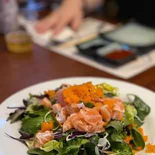 a white plate with a salad on it