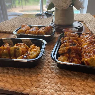 three trays of food on a table