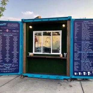 It&apos;s a snow cone stand in a shipping container!! Find them in the Plaza. July 2018.