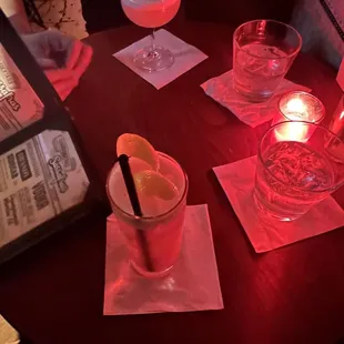 a table with drinks and a menu