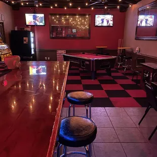 a game room with a pool table