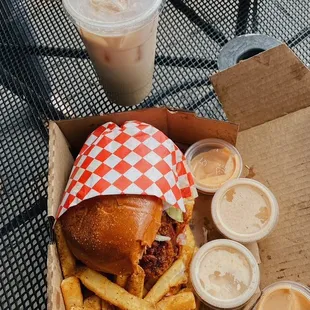 a burger and fries on a table