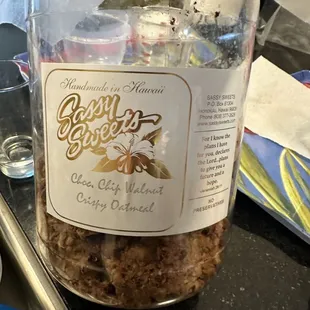 a jar of granola and a glass of water