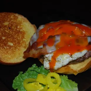 a burger with bacon and cheese