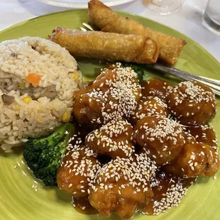 Sesame chicken with non spicy fried rice and add on egg rolls.