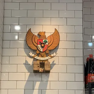 the emblem on the wall of a restaurant