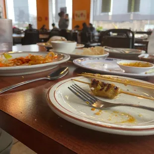 plates of food and utensils on a table