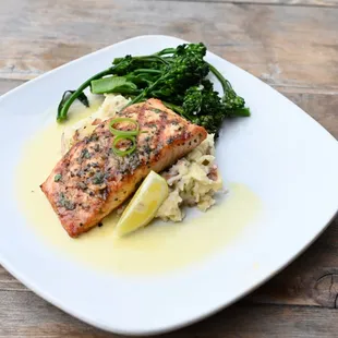 a plate of food on a wooden table