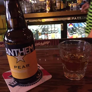 a bottle of beer and a glass