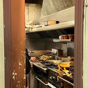 a man preparing food in a kitchen