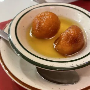 Sweet donuts in cardamon sauce