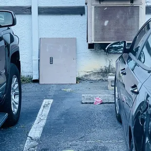 two cars parked in a parking lot