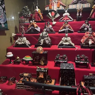 a large display of asian figurines