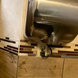 Possible fire hazard in nasty bathroom.