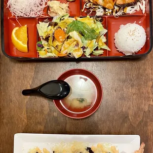 two plates of food on a wooden table