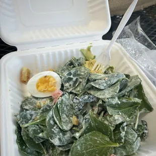 Soggy spinach with half yes HALF an egg and a bite of avocado. That&apos;s how it arrived for $13.68