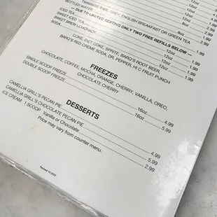 a menu on a marble table