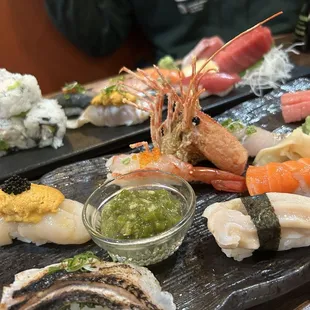 Omakase Nigiri (front), Sushi Deluxe (back)