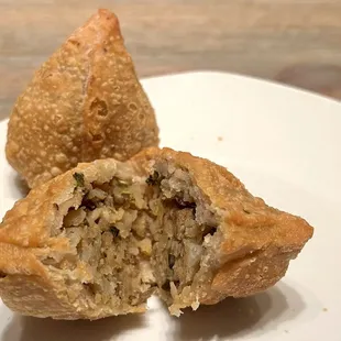 Samosa. Densely crisp outer shell, with potatoes and vegetables inside. It's a heavy appetizer, so share it!