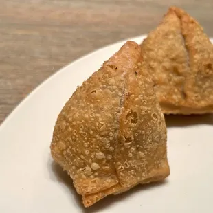 Samosa. Densely crisp outer shell, with potatoes and vegetables inside. It's a heavy appetizer, so share it!